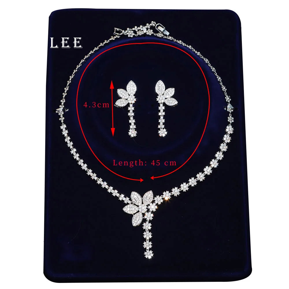 Decorative silver flower necklaces and earrings